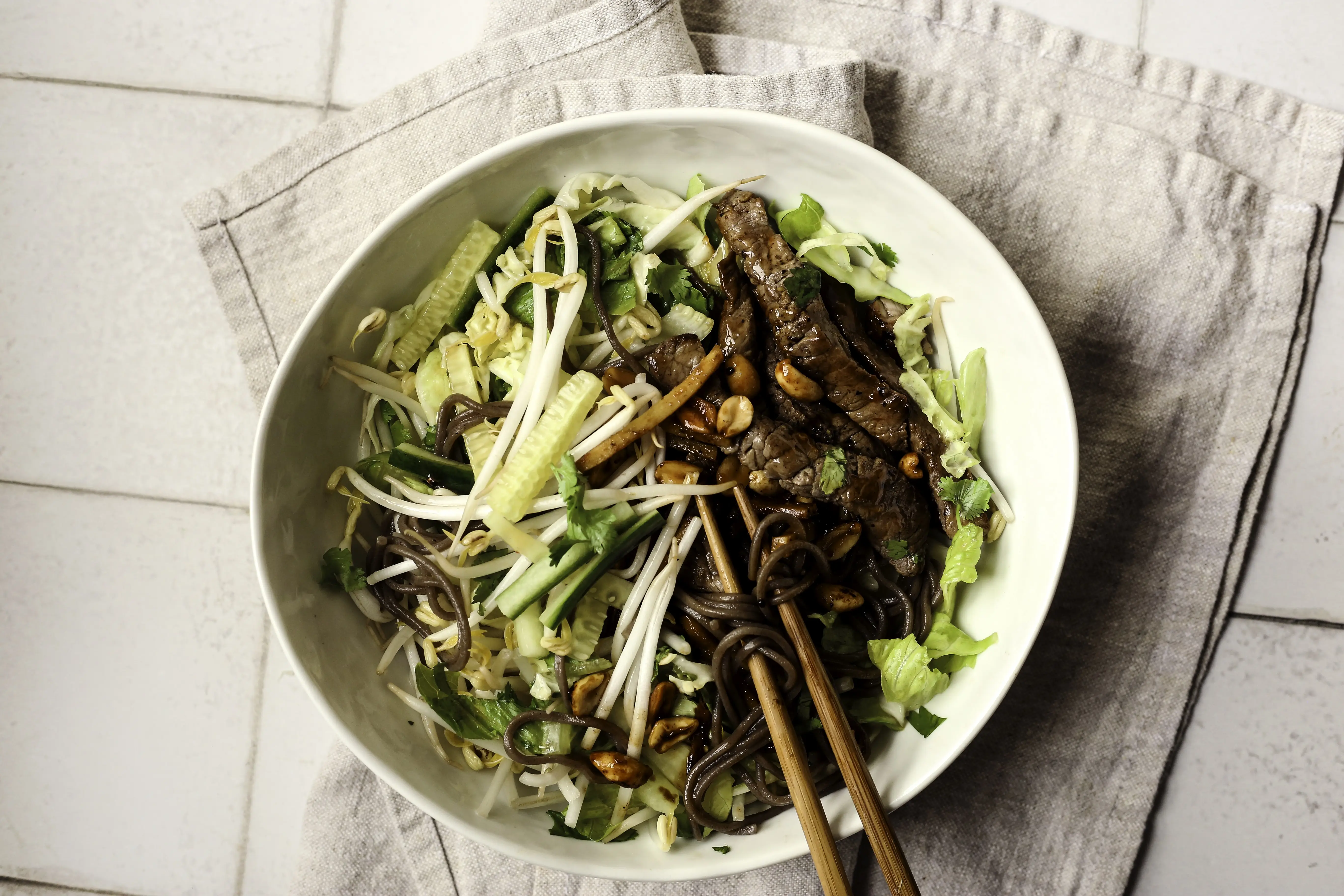 Sticky ginger beef spring roll salad