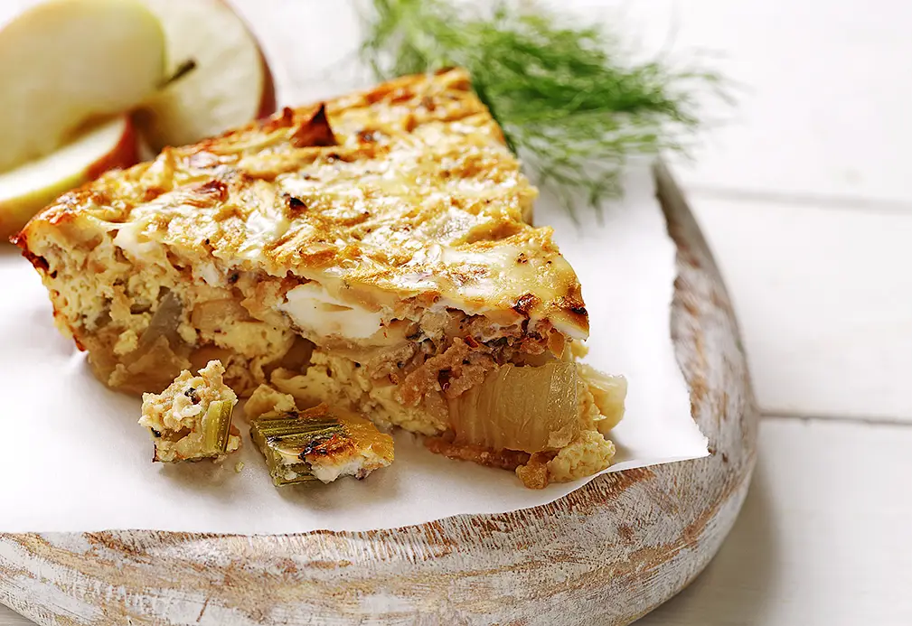 a piece of food on a wood plate