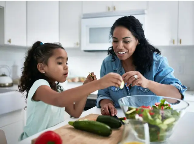 girl-learning-to-prepare-meal-from-mother-picture-id1127294863 girl-learning-to-prepare-meal-from-mother-picture-id1127294863