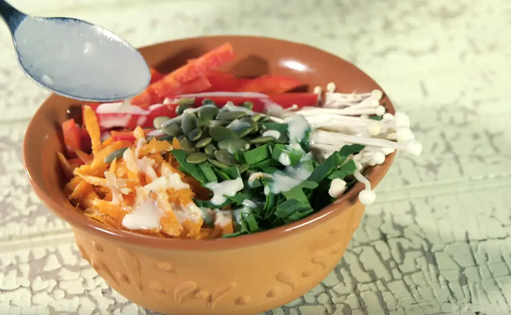 Garden veggie buddha bowl with lentils and tahini sauce